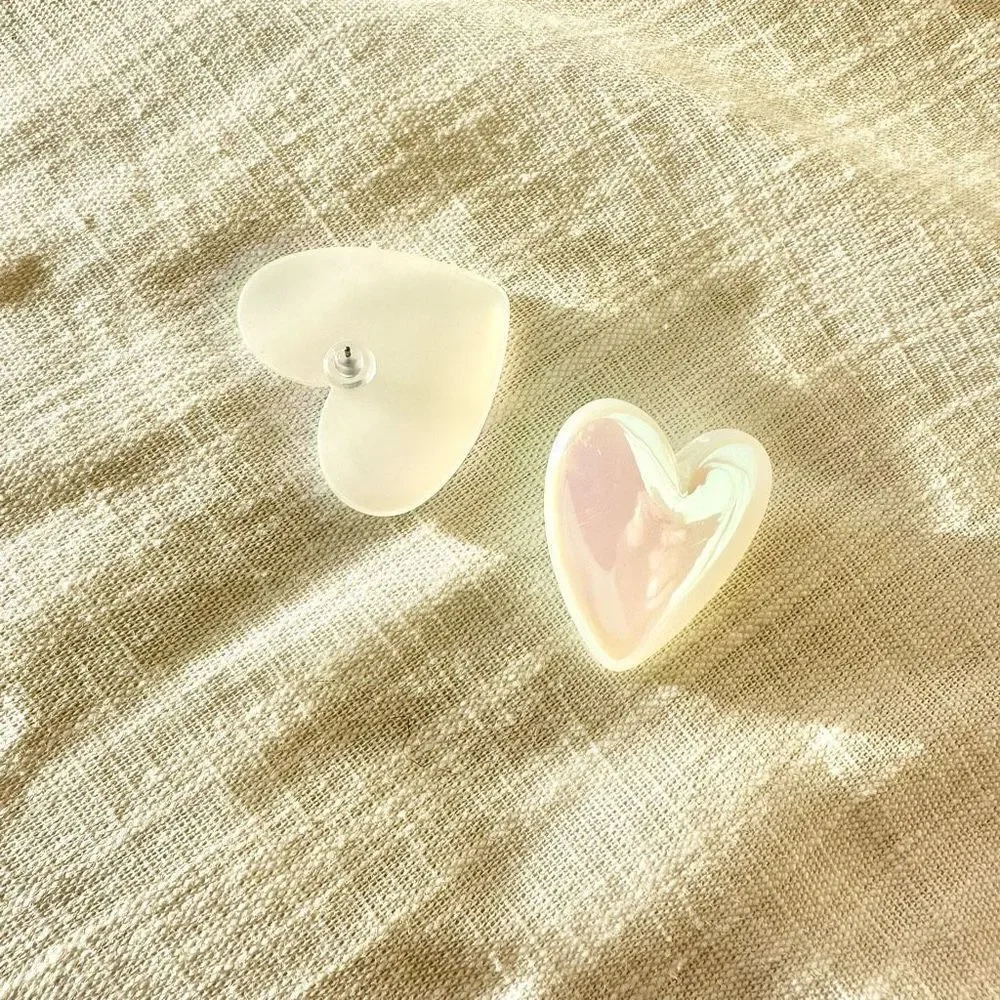 Iridescent white heart shaped stud earrings